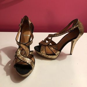 Elle gold and black glitter heels